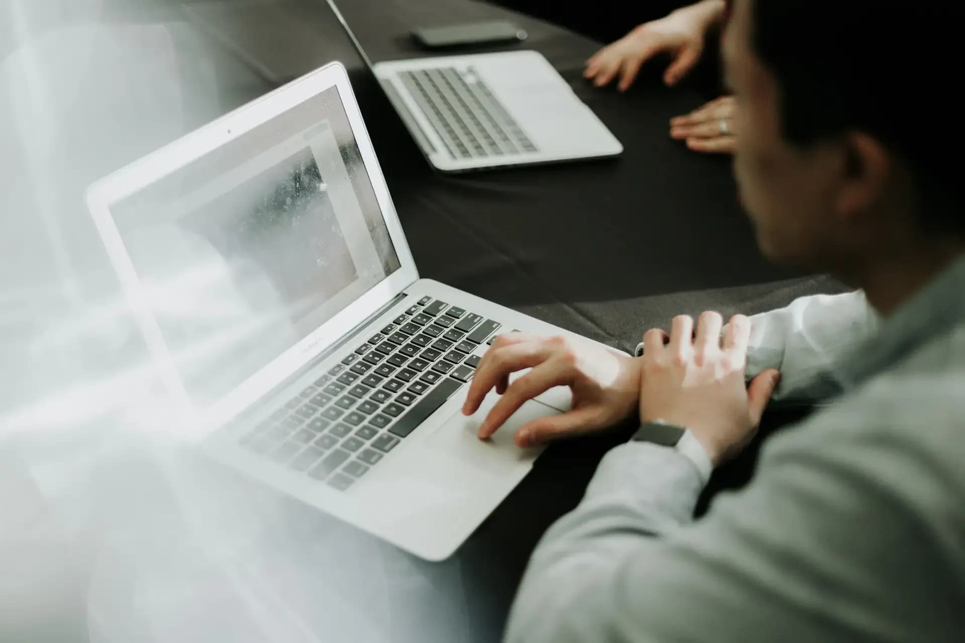 People sitting in front of laptops